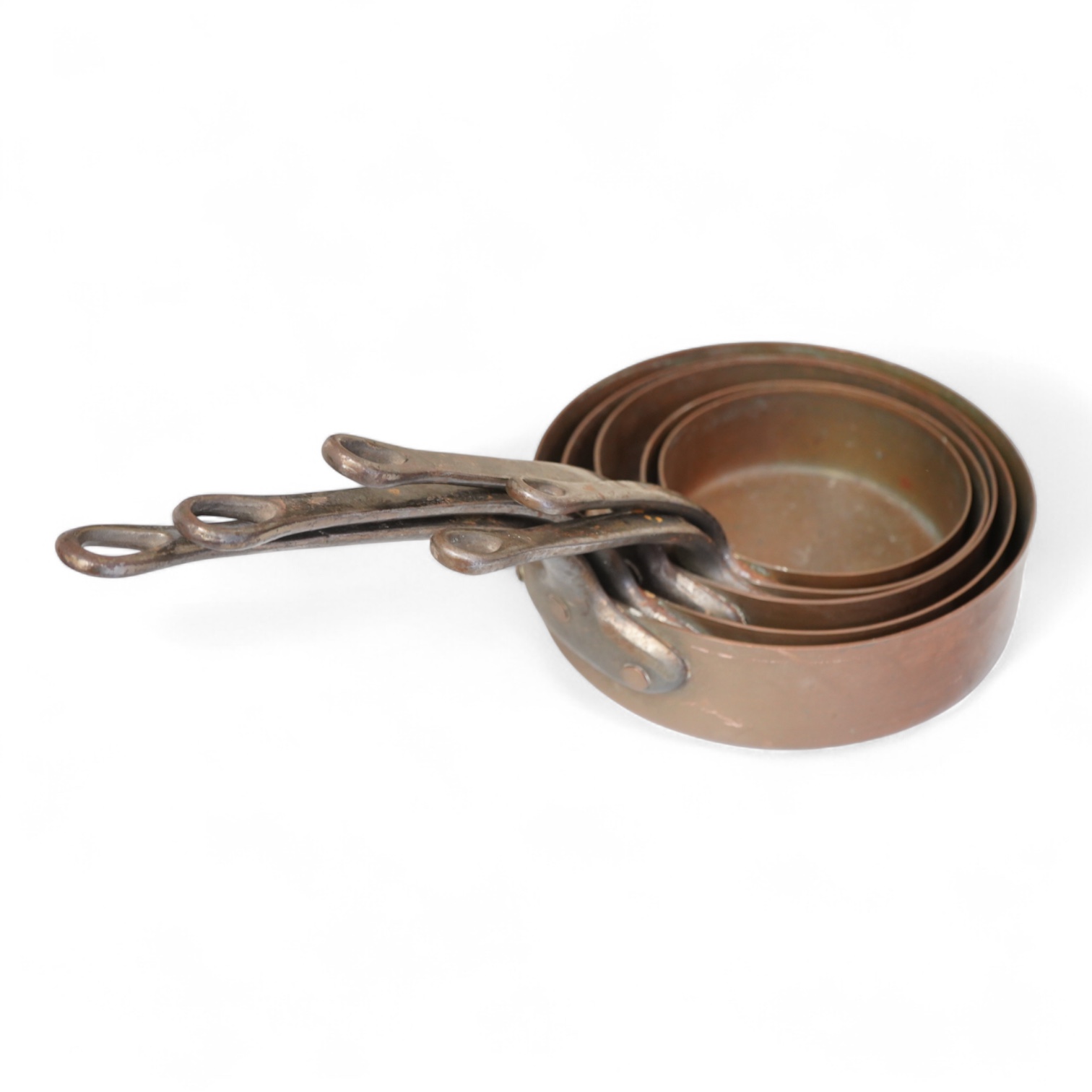 A graduated set of five copper saucepans, largest 40cm wide
